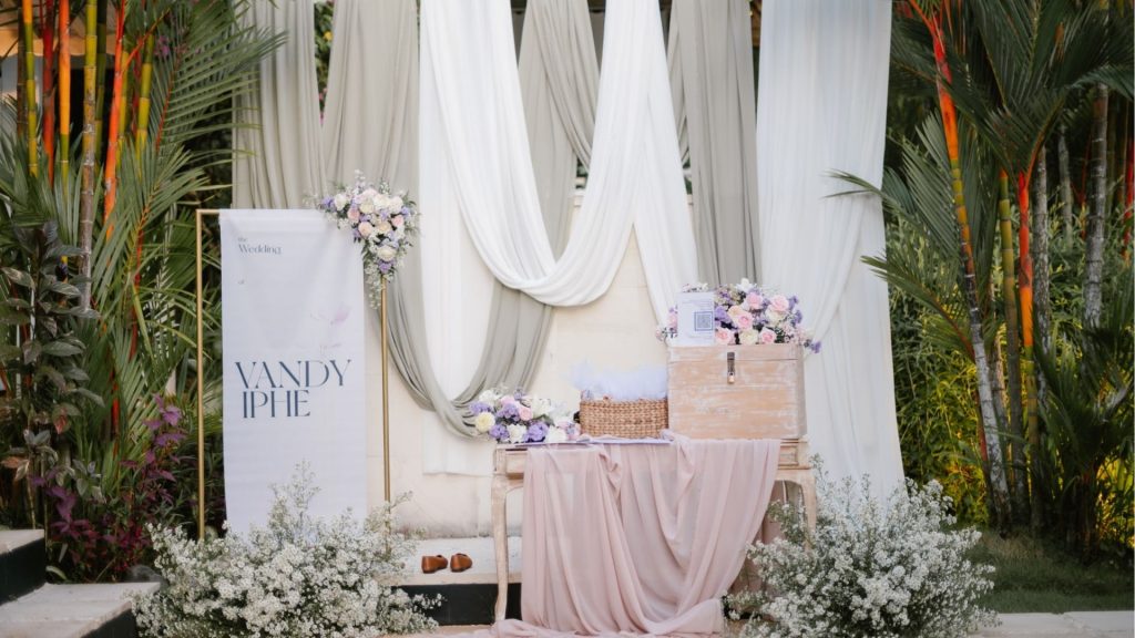 romantic white fabric and roses arch