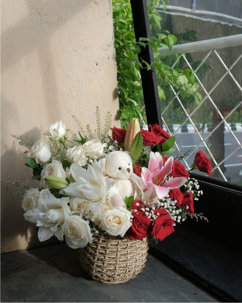roses, lilies, and cute teddy bear