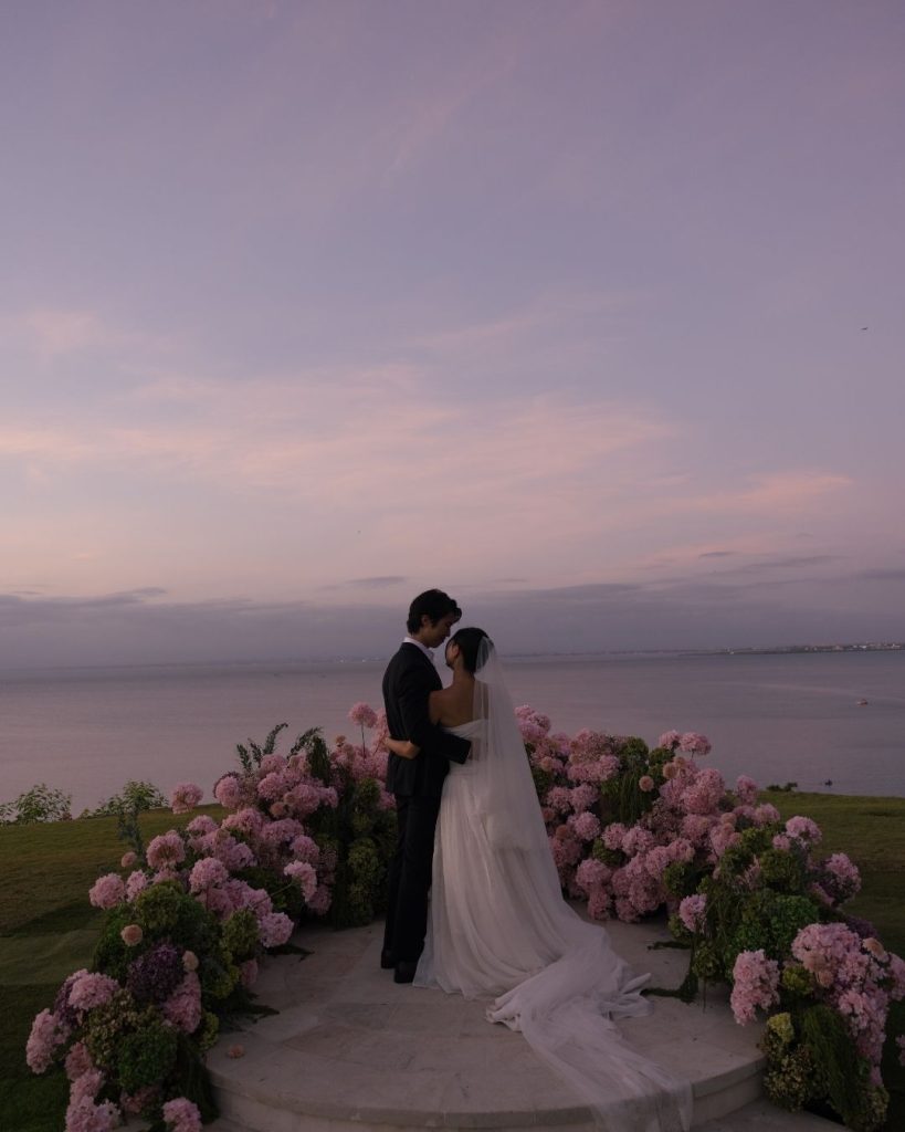 intimate wedding with sunset views and pink flowers